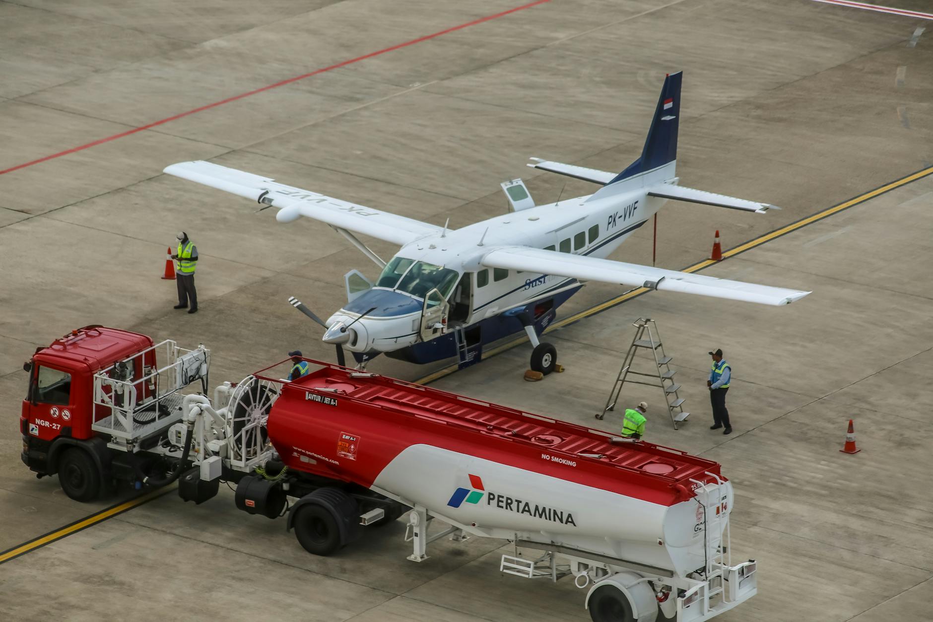 small aircraft refueling at airport tarmac