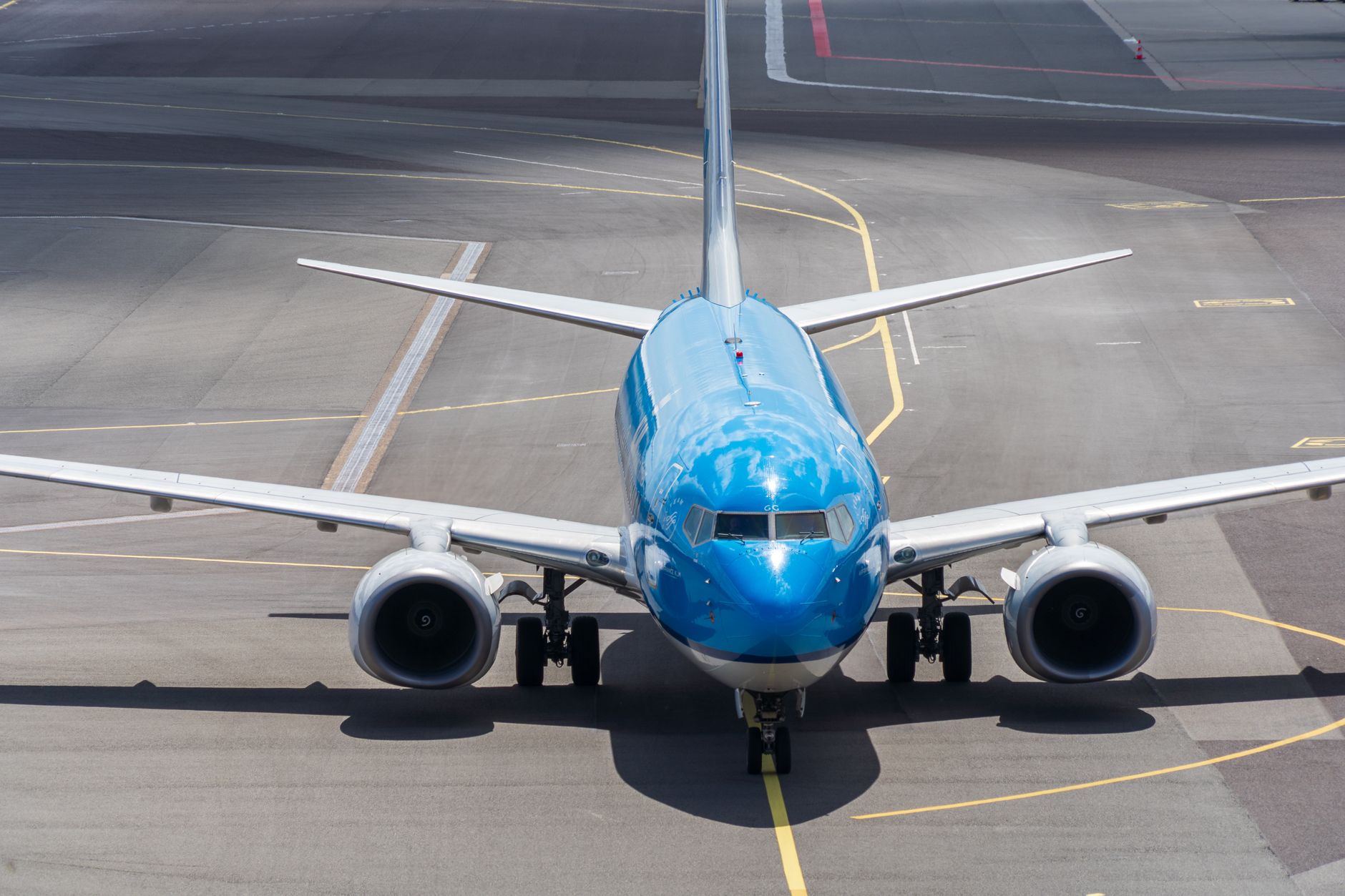 front view of airplane on airport runway
