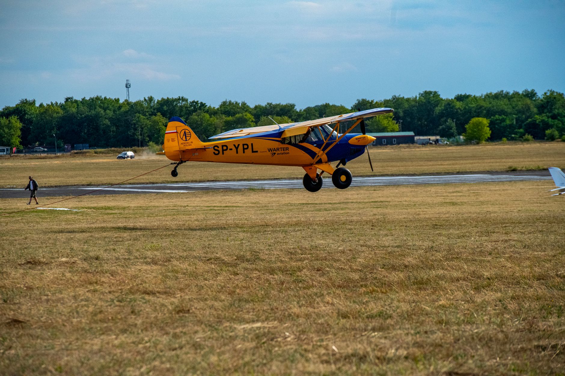 a small airplane is taking off from a runway