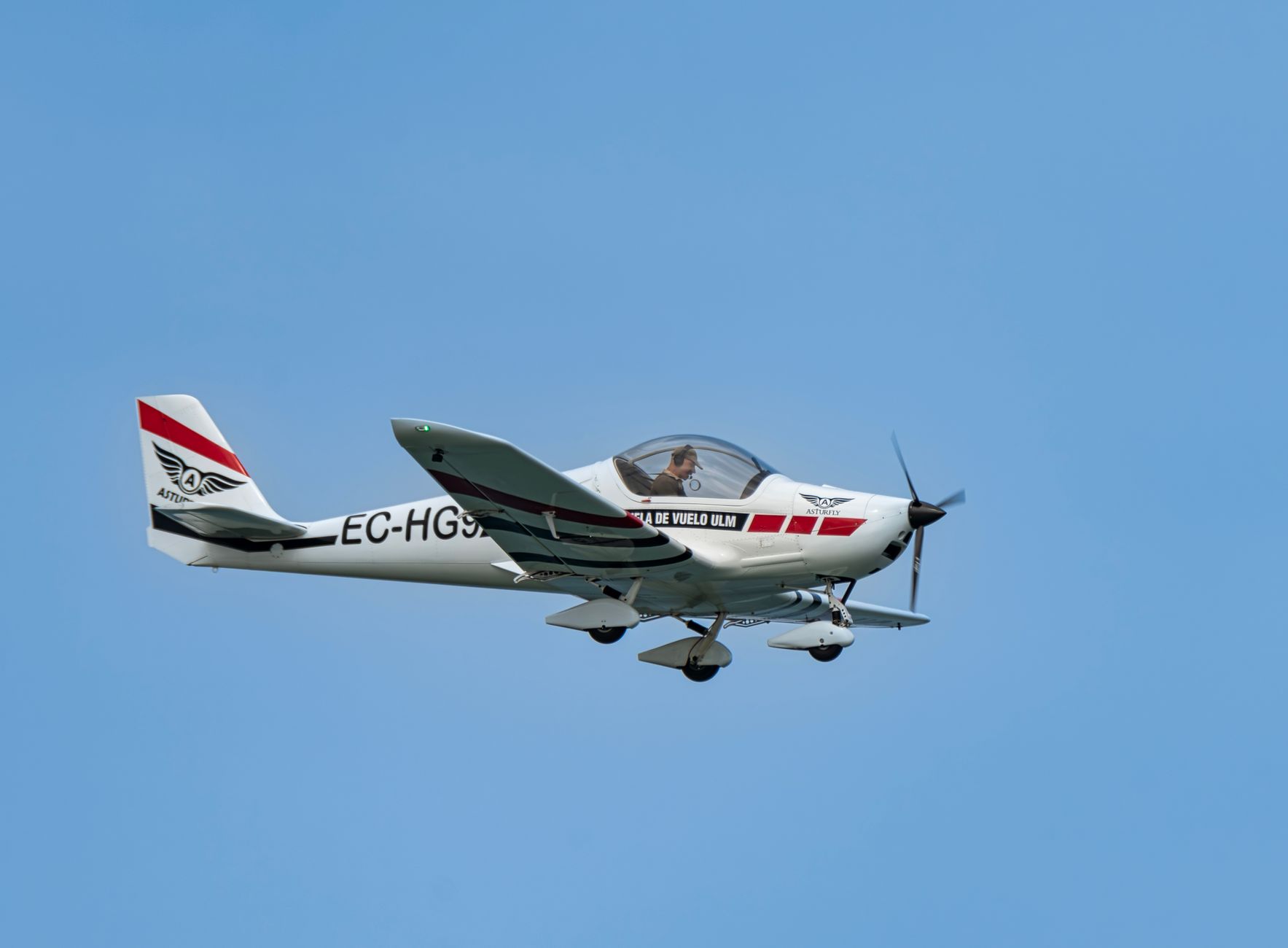 a small airplane flying in the sky