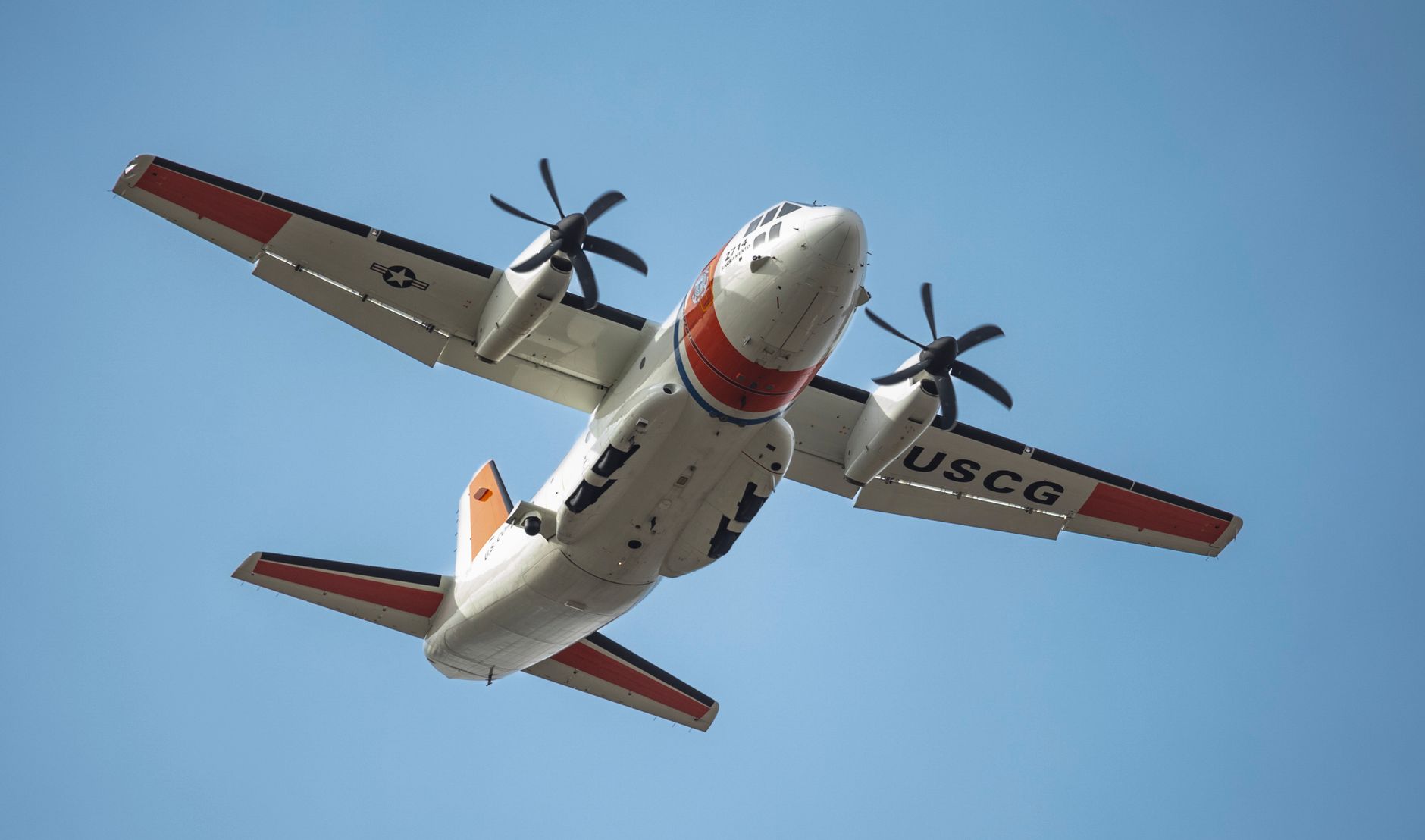 red and white airplane in close up shot