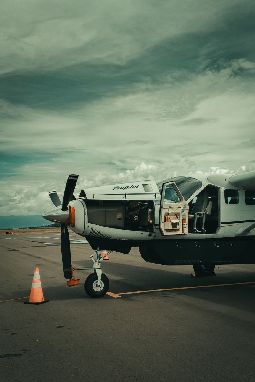 small propeller plane at airport runway