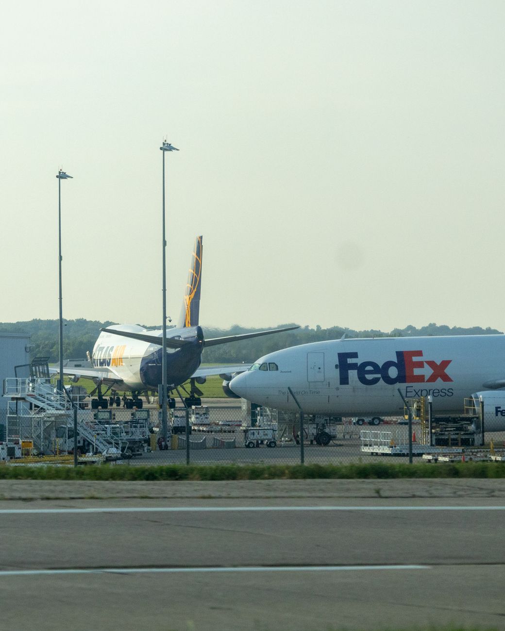 fedex and cargo planes parked at airport